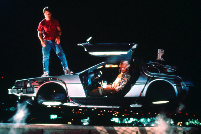 MIchael J Fox standing on the floating DeLorean